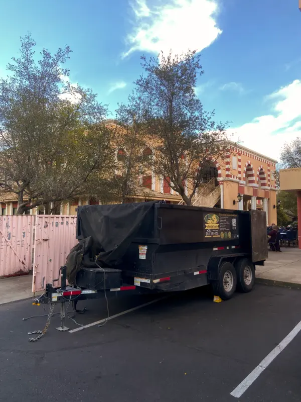 Sactown Junk Removal trailer parked in Sacramento for dumpster rental service